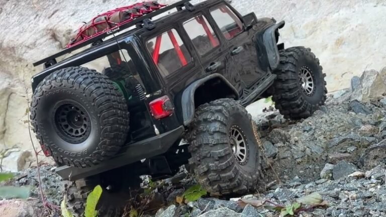 1/6 scale RC Jeep crawler (Axial SCX6) on a rocky trail