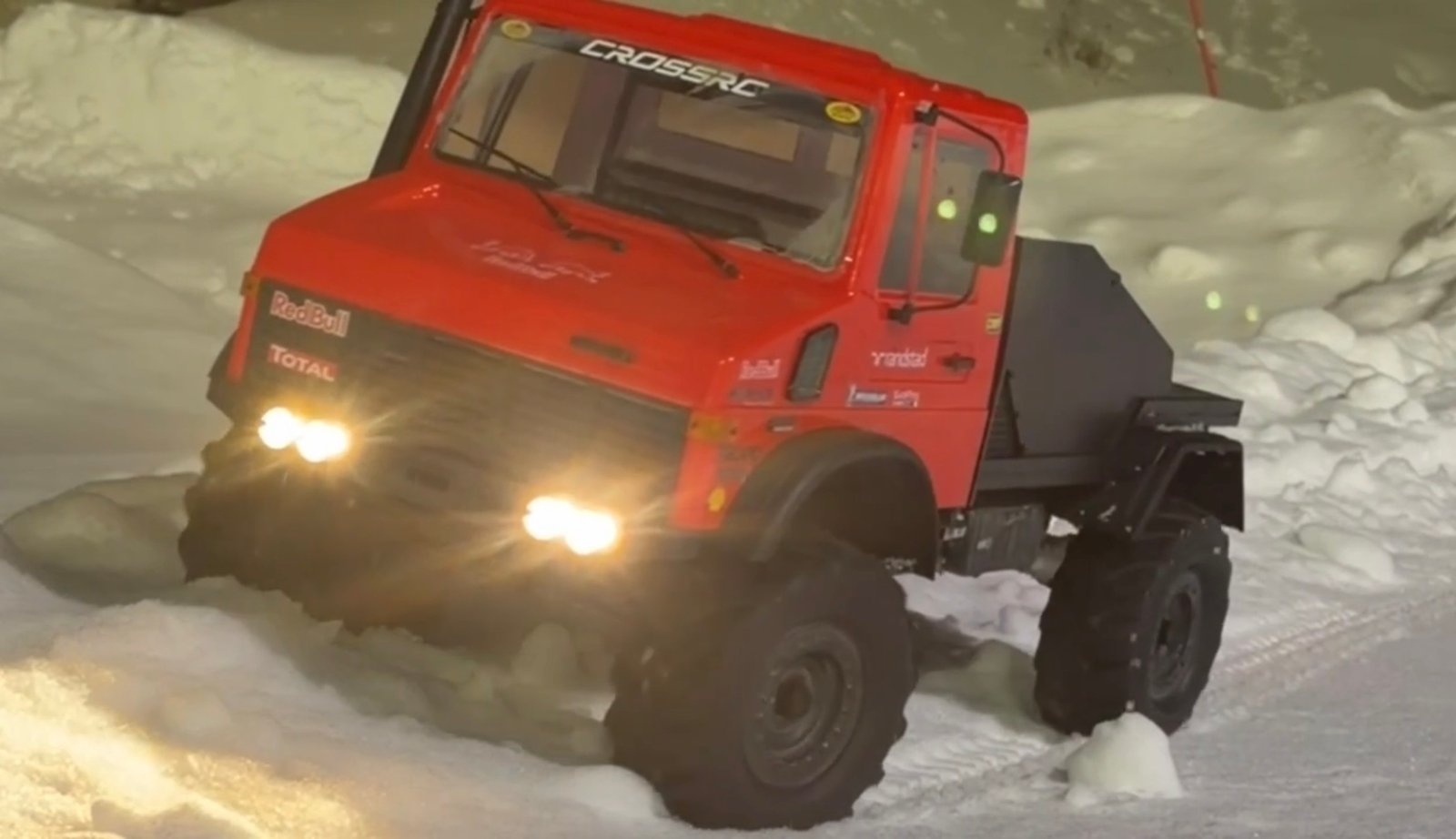 1/6 scale RC Unimog driving in snow