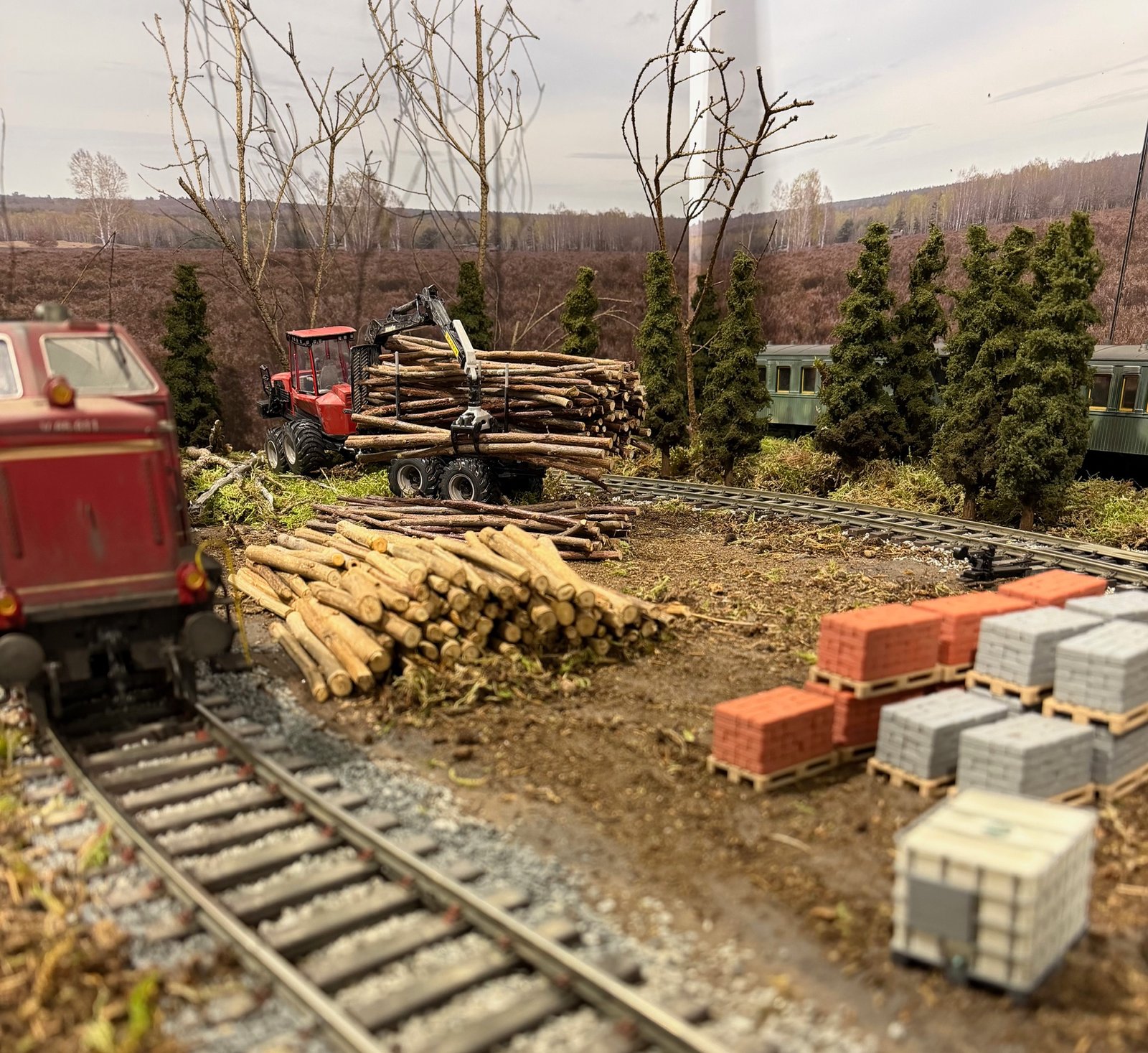 Forestry machine and V65 locomotive on a Gauge 1 model railway